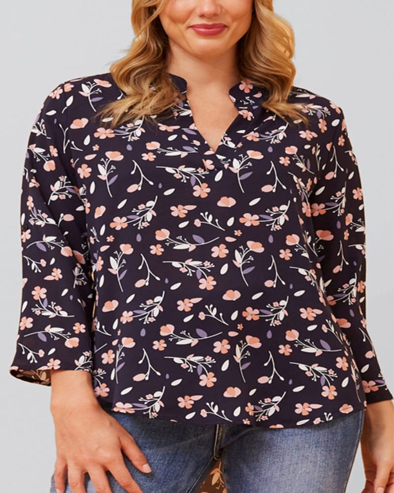 Side of a model wearing a size XL Sherine Blouse Floral Print V Neck Navy in Navy by ANNICK. | dia_product_style_image_id:353198